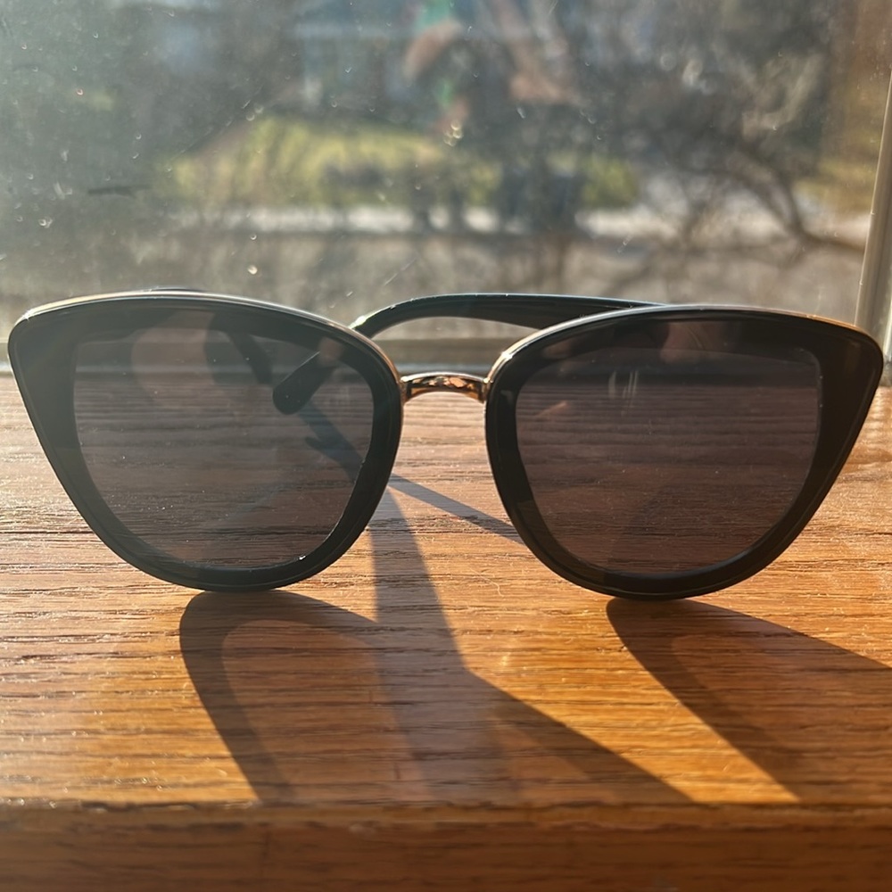 Black gold rimmed sunglasses